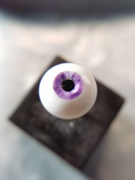 Purple BJD doll eye with nicks